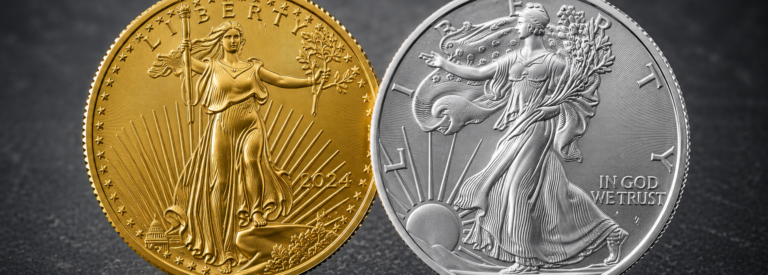Two large coins side by side: a gold Libertad-style coin on the left with a standing Liberty figure, rays, and the year 2024; a silver coin on the right featuring a standing Liberty with a rising sun motif and the inscription IN GOD WE TRUST.