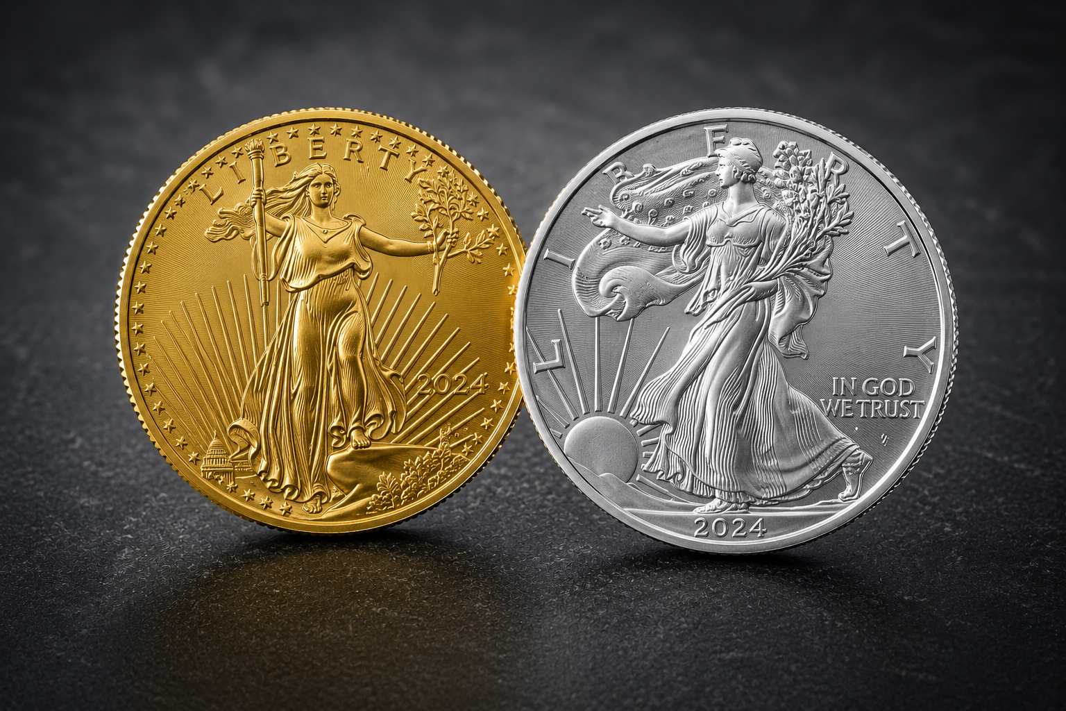 Gold and silver coins standing upright side by side on a dark surface; the gold coin shows Liberty with a torch and olive branch, 2024, and the silver coin shows Walking Liberty with sun rays and 'IN GOD WE TRUST'.