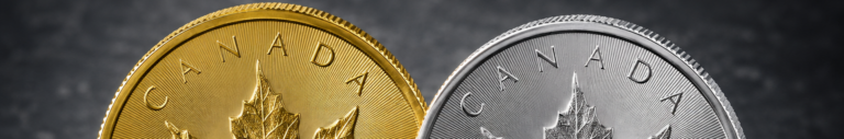 Close-up of gold and silver Canadian coins with a maple leaf design.